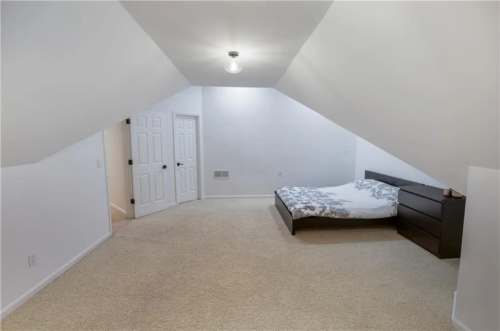 Bedroom 2.  Oversized with sitting area and walk-in closet.