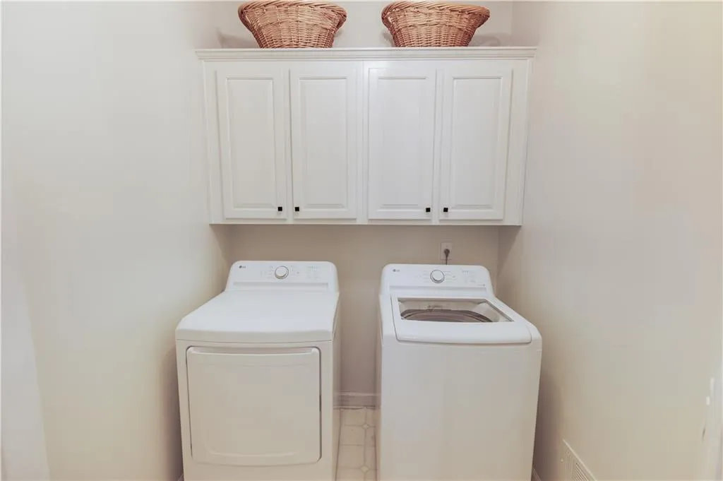 Main Level Laundry just outside Primary Suite near Kitchen