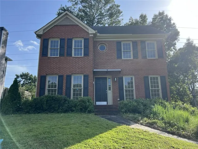 Brick exterior with a gabled roofline