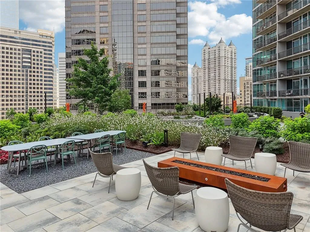 View of patio with outdoor dining area and a view of skyline