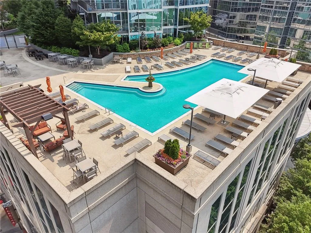 Community pool featuring a patio