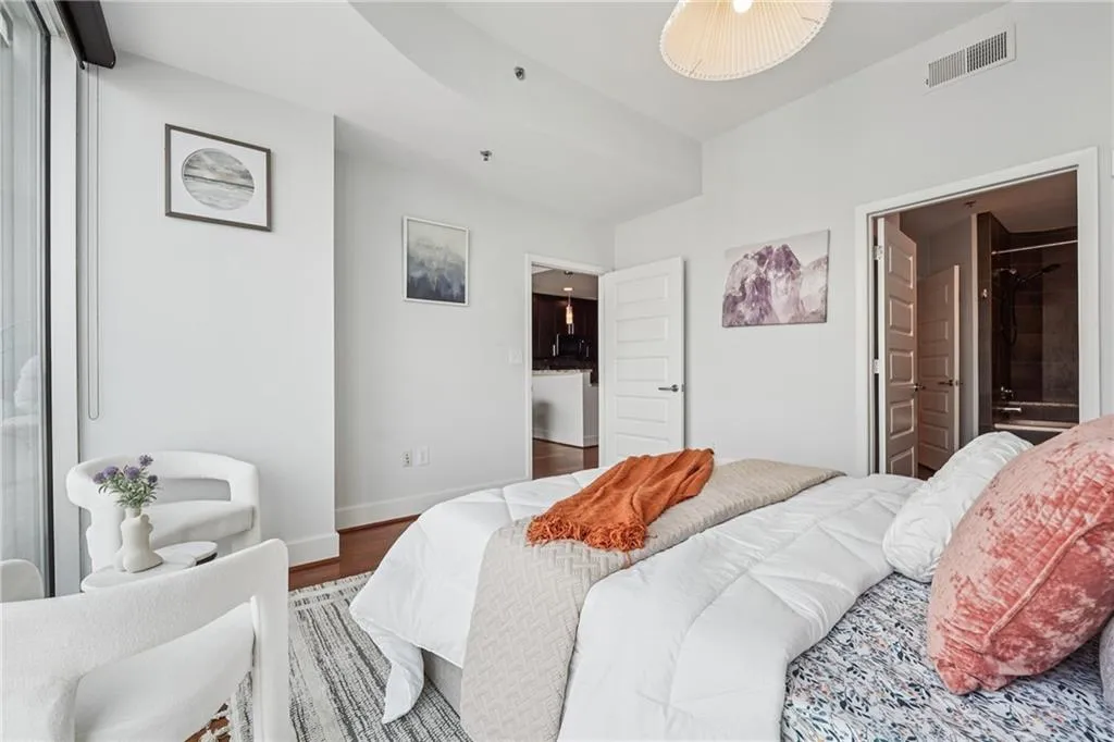 Bedroom featuring wood finished floors and baseboards