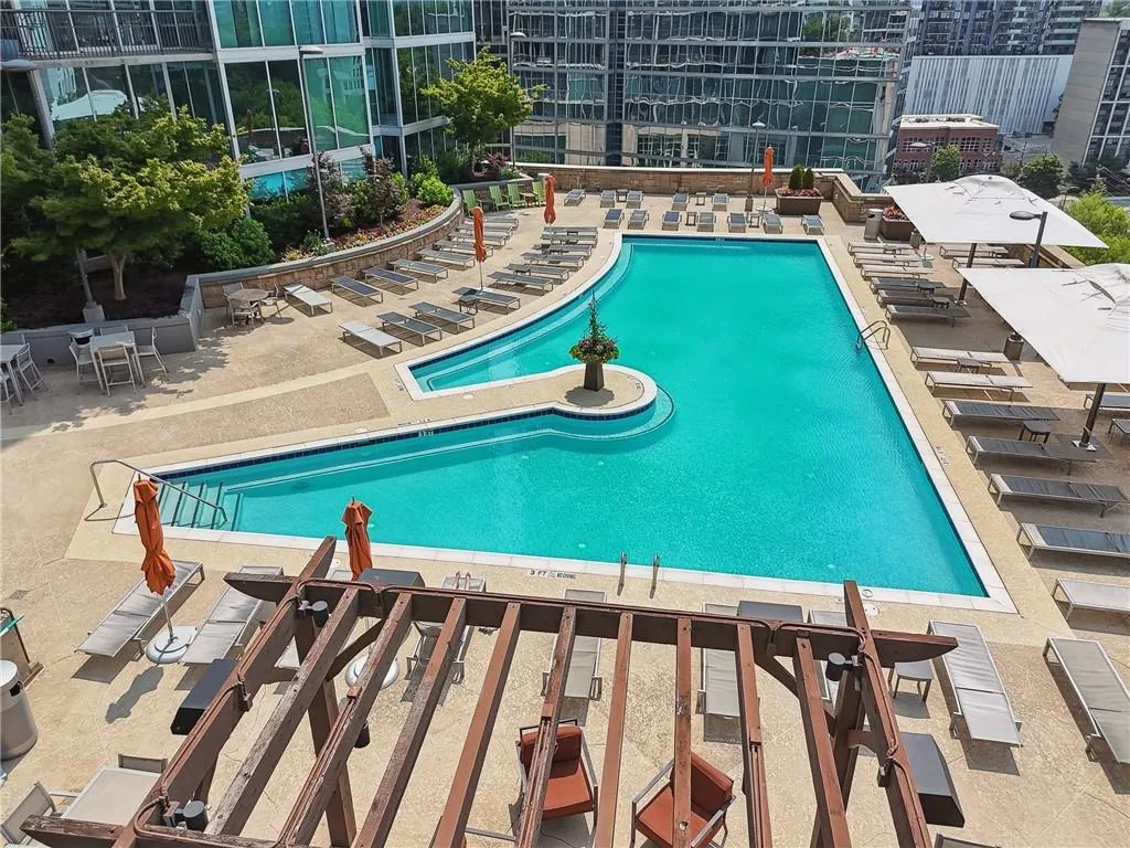 Community pool with a patio area