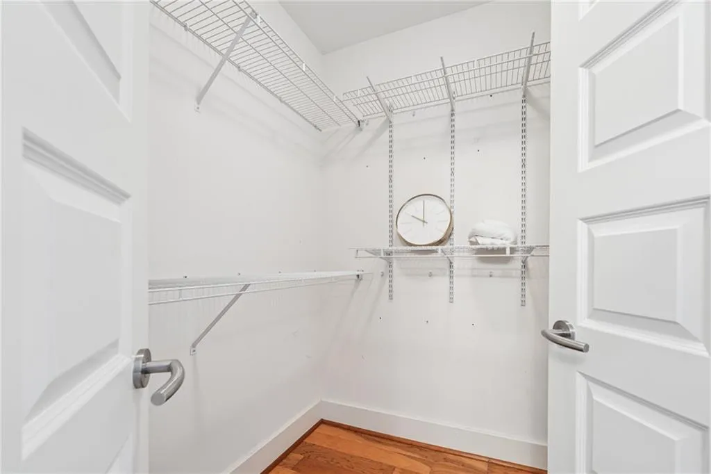 Walk in closet featuring light wood-style flooring