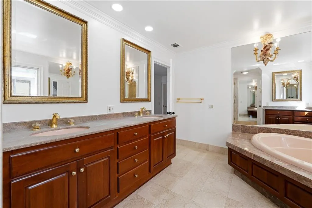 Close up of the Master Bathroom dual vanity with Marble countertop.
