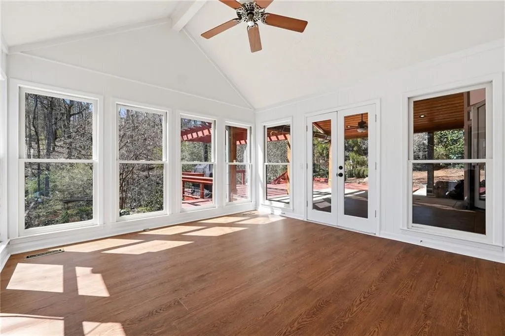 This sun room will be one of your favorite rooms with its high ceilings and non-stop windows.