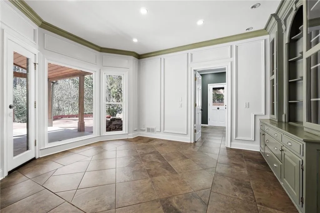 Another view of the eat-in kitchen with it's stunning window placement overlooking the backyard. The door here goes to the pantry, mud room/laundry room and half bathroom.
