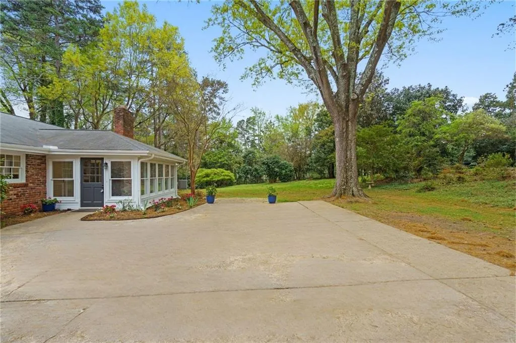 Expansive backyard and parking pad/sports court