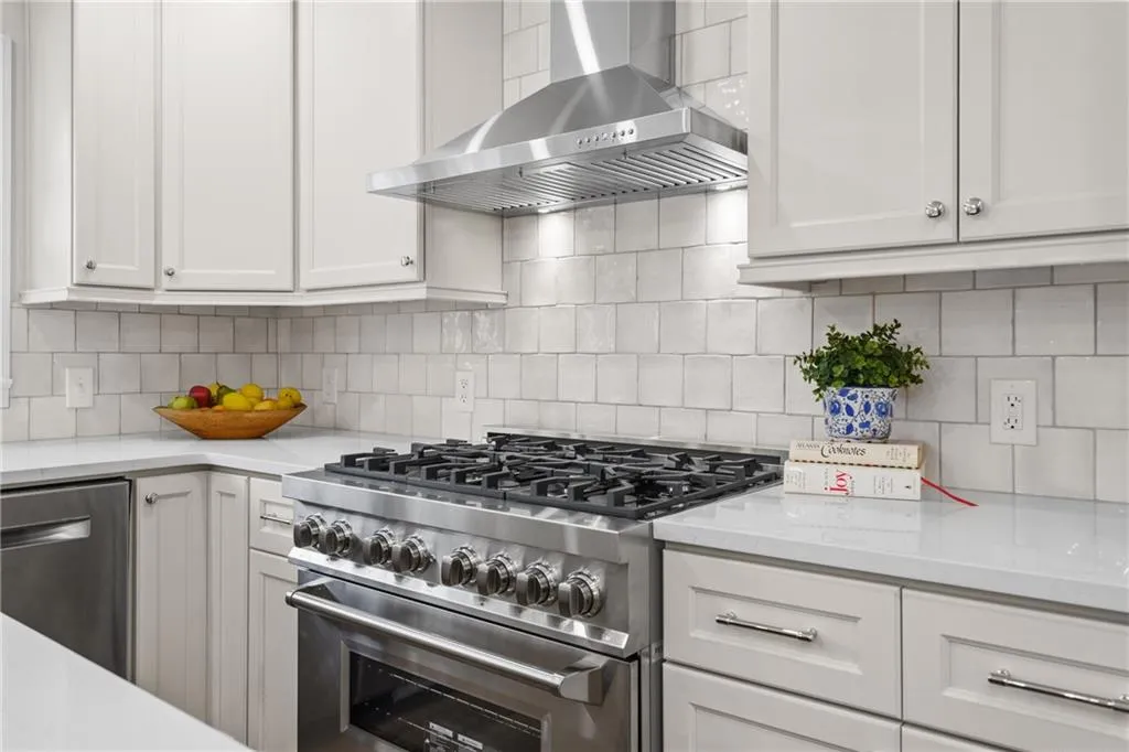 Upgraded appliances with Zline 6 burner dual fuel stove with matching vent hood