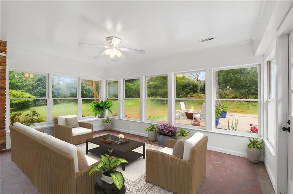 Year 'round sunroom is the perfect place to start or end your day. Virtually staged