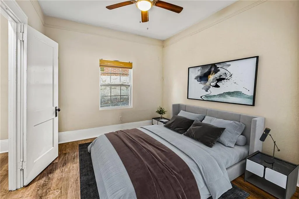 Bedroom featuring wood finished floors and ceiling fan