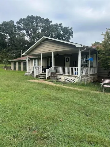 Covered front porch with white railing