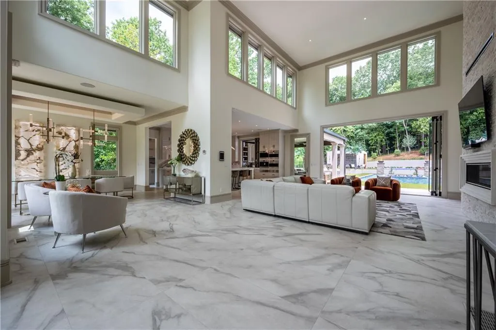 Soaring ceilings with abundant clerestory windows flood this open-concept living space with natural light