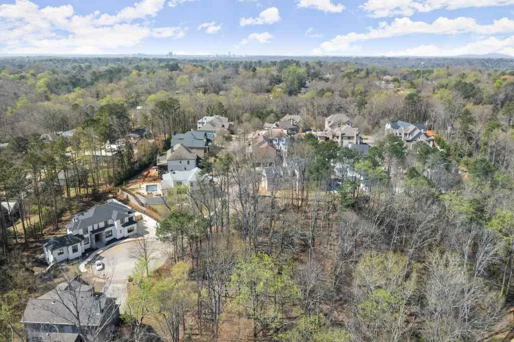 Lot is between the 2 homes at the end of the culdesac.  It will have a long driveway and the home will sit on a wide lot positioned behind those 2 homes. Lot is between the 2 homes at the end of the culdesac.  It will have a long driveway and the home will sit on a wide lot positioned behind those 2 homes.