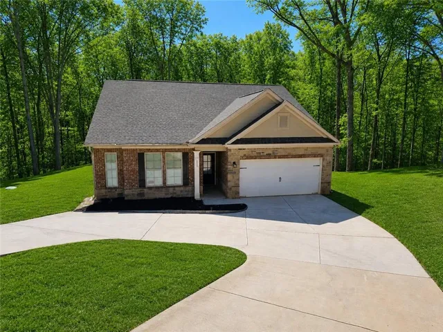 Brick and stone veneer exterior with a gabled roof