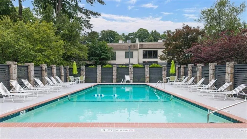 Community pool with a patio area