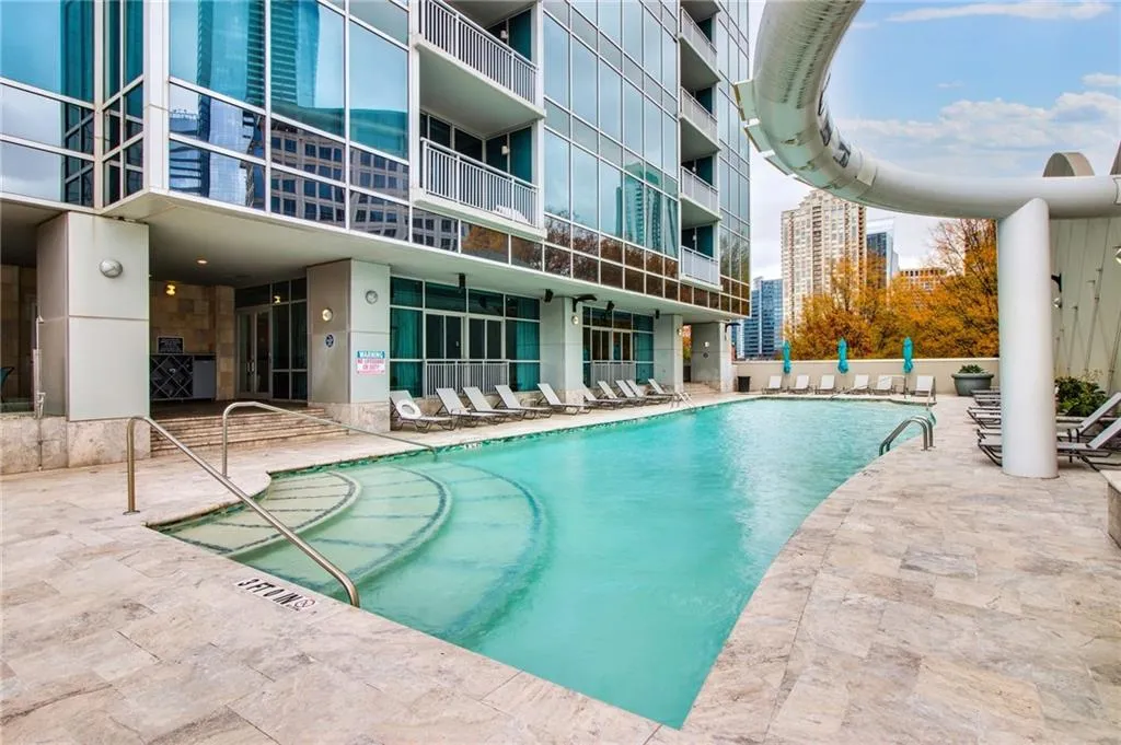 Community pool featuring a patio