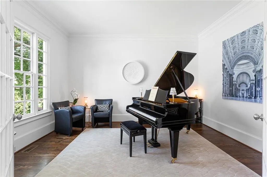 Miscellaneous room featuring crown molding, a wealth of natural light, and dark hardwood / wood-style floors