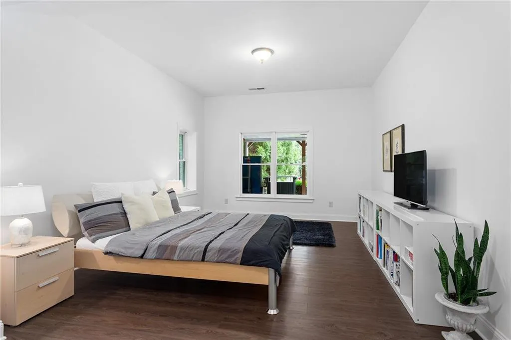 Bedroom featuring dark hardwood / wood-style flooring