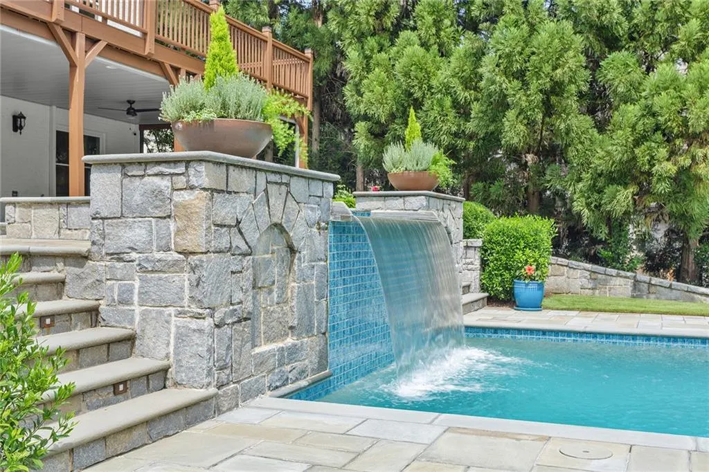 View of swimming pool with ceiling fan