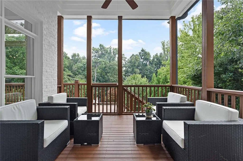 Sunroom / solarium featuring ceiling fan