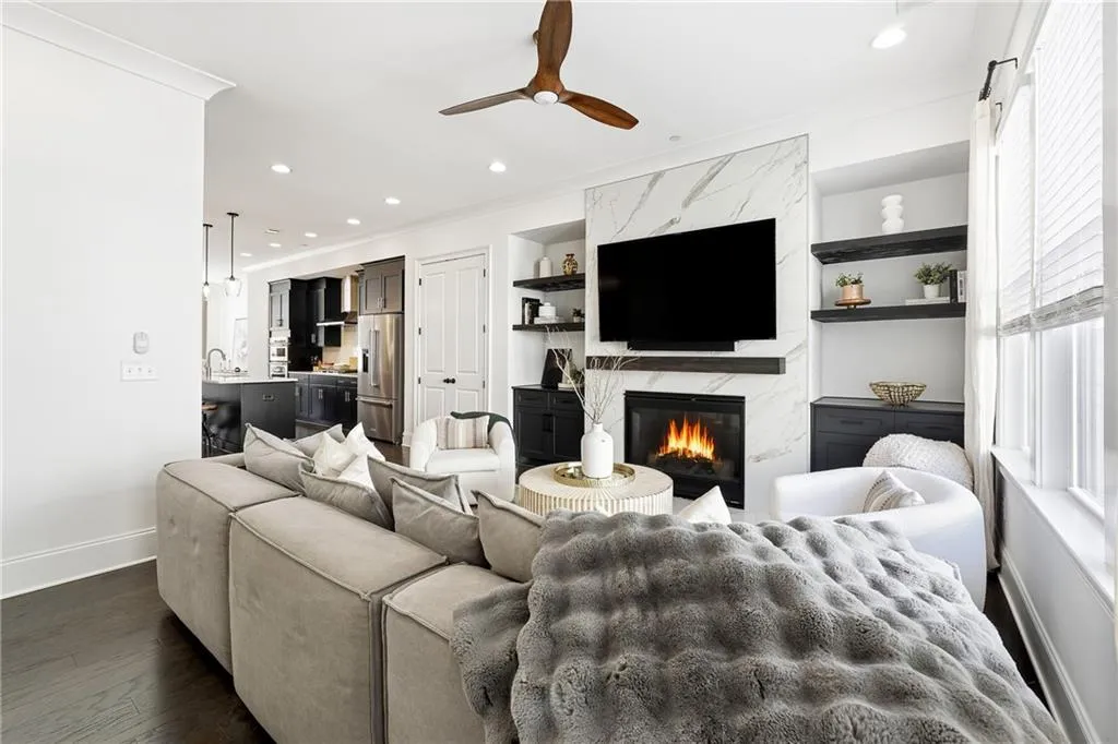 Custom Built Ins were added, along with a Marble Fireplace to the ceiling and Custom Mantle!
