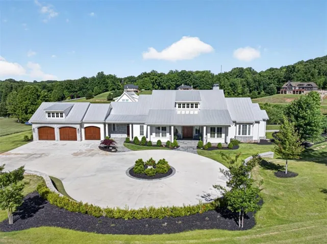 Completed in 2022 this home is built with Hardiplank siding, imported stone work, and metal roofing.