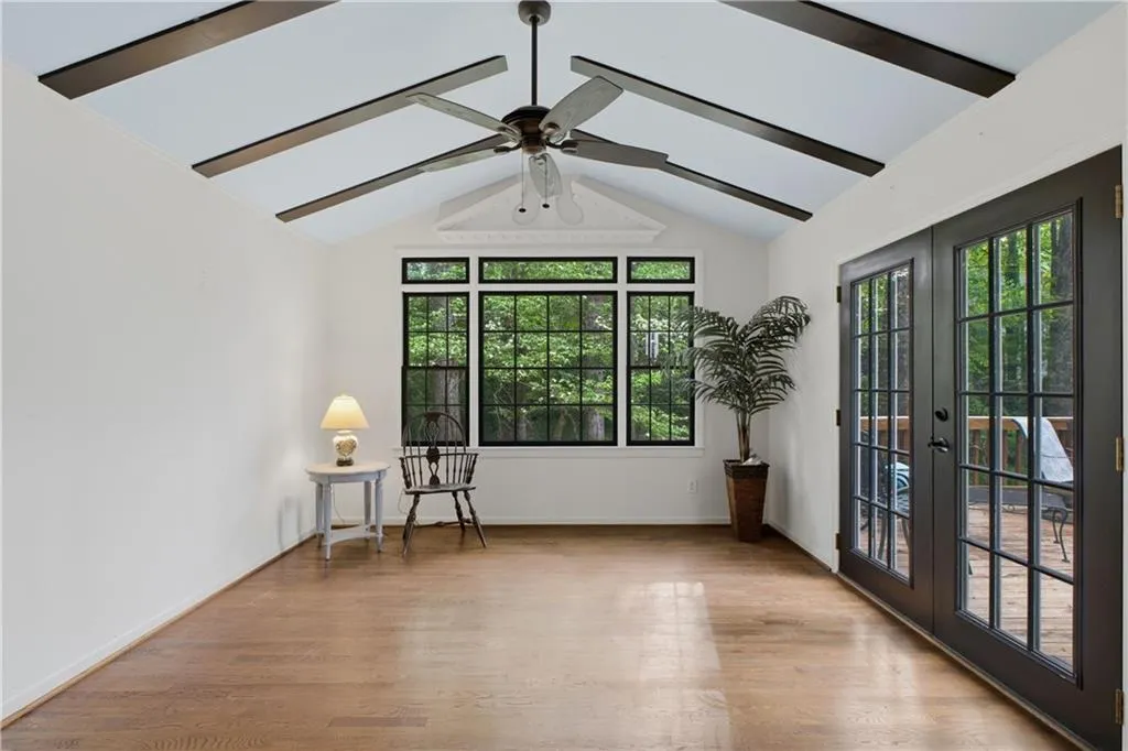 Vaulted with ample windows! French doors to large deck!
