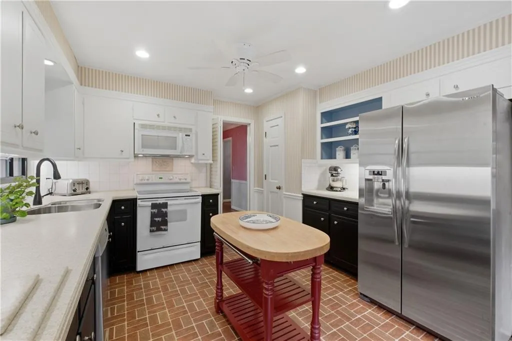 Functional kitchen layout with pantry and window to breezeway!