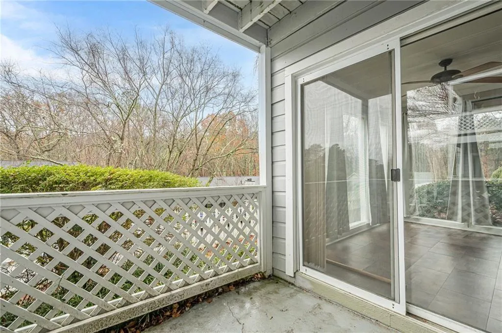 Balcony featuring a sunroom