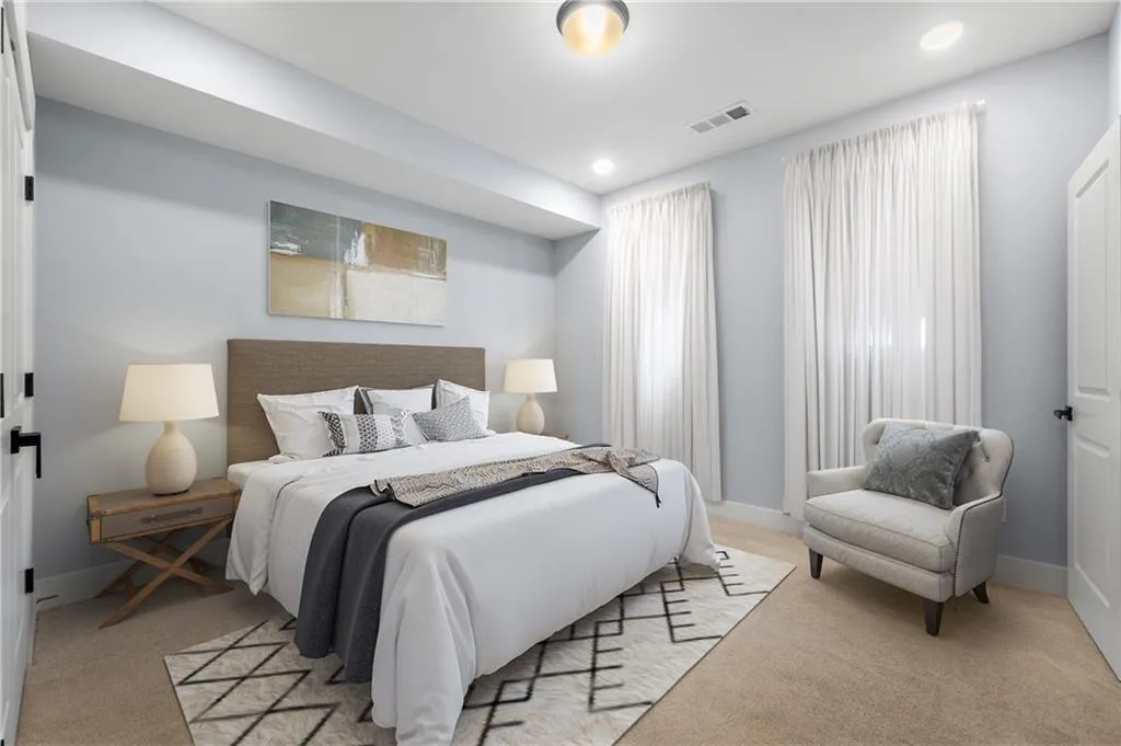 Bedroom featuring light carpet, recessed lighting, visible vents, and baseboards