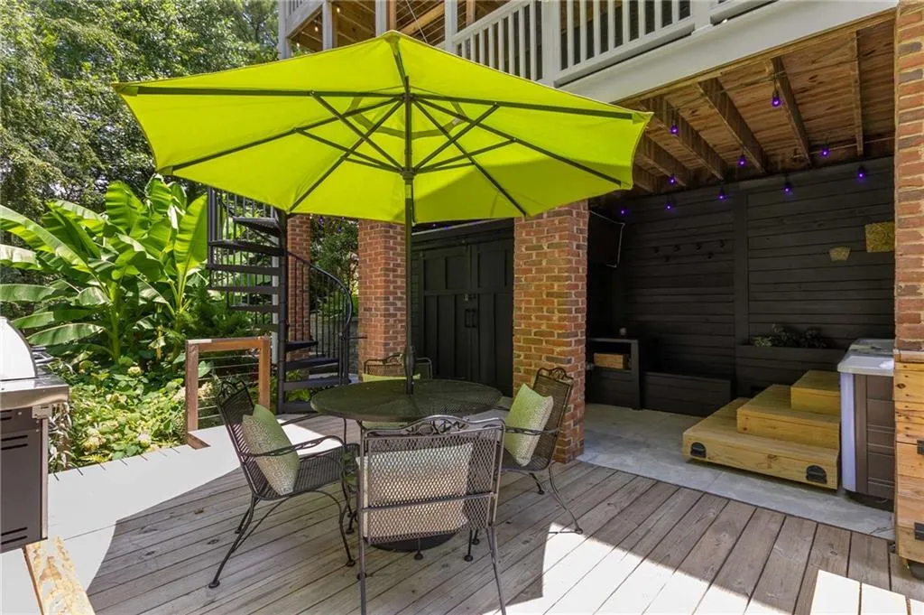 There is a storage closet in the background to store outdoor cushions and other items