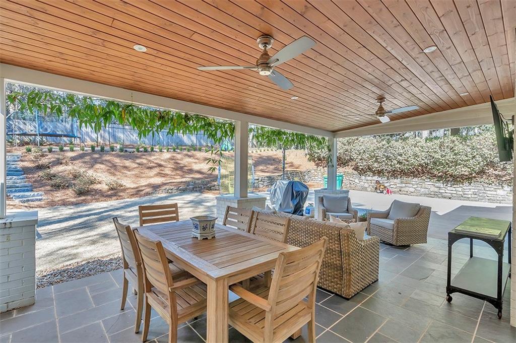 View of patio / terrace with an outdoor living space and ceiling fan