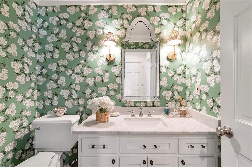 Bathroom with vanity, ornamental molding, and toilet