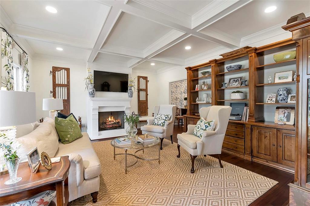 Sitting room with coffered ceiling, light hardwood / wood-style flooring, and beamed ceiling