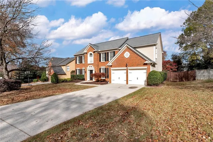 Brick and siding exterior with a two-car garage