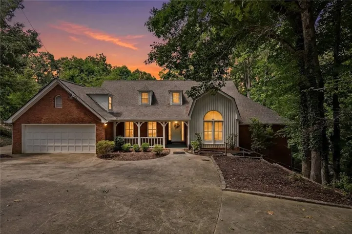 Brick-front residence with a two-car garage and a wide driveway