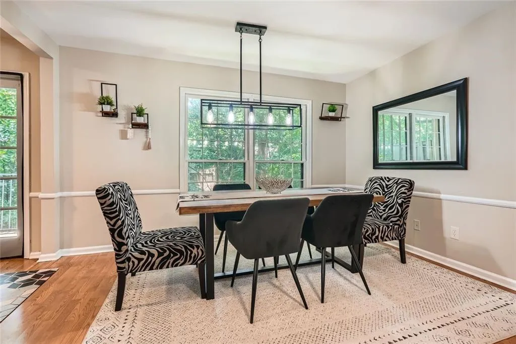 Dining space featuring plenty of natural light and wood finished floors