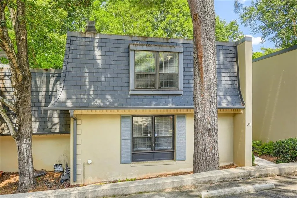 View of side of home featuring stucco siding