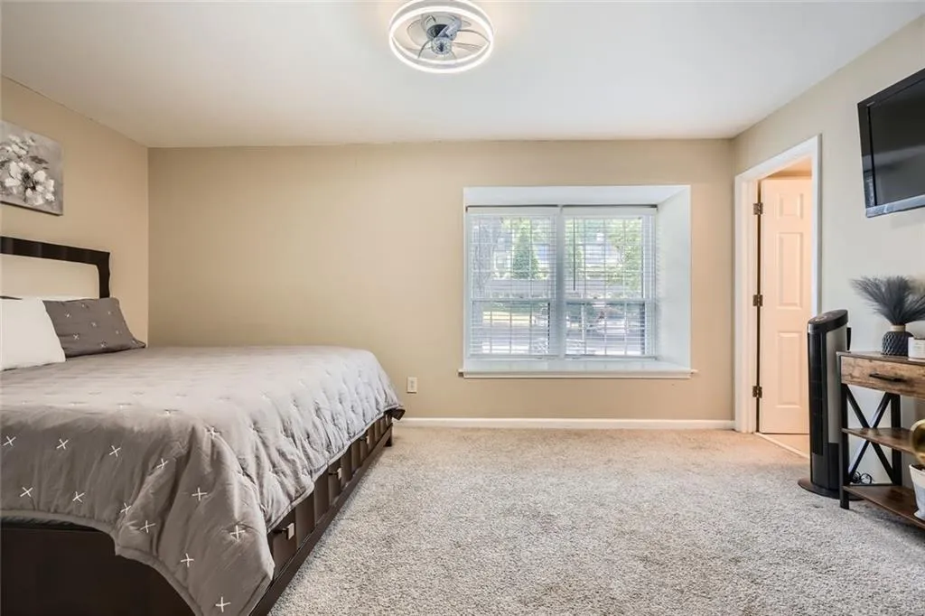 Bedroom with carpet and baseboards