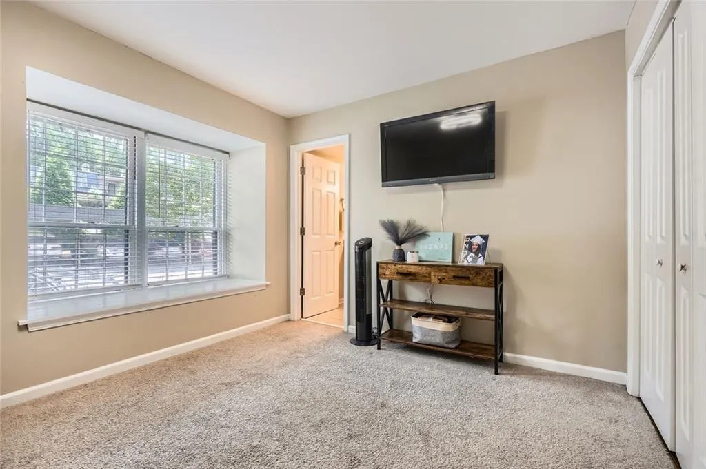 Bedroom featuring a closet and carpet