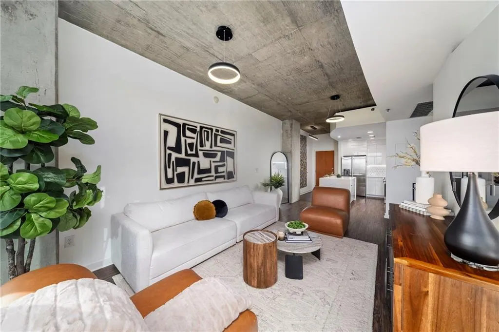 Living room with wood finished floors and baseboards