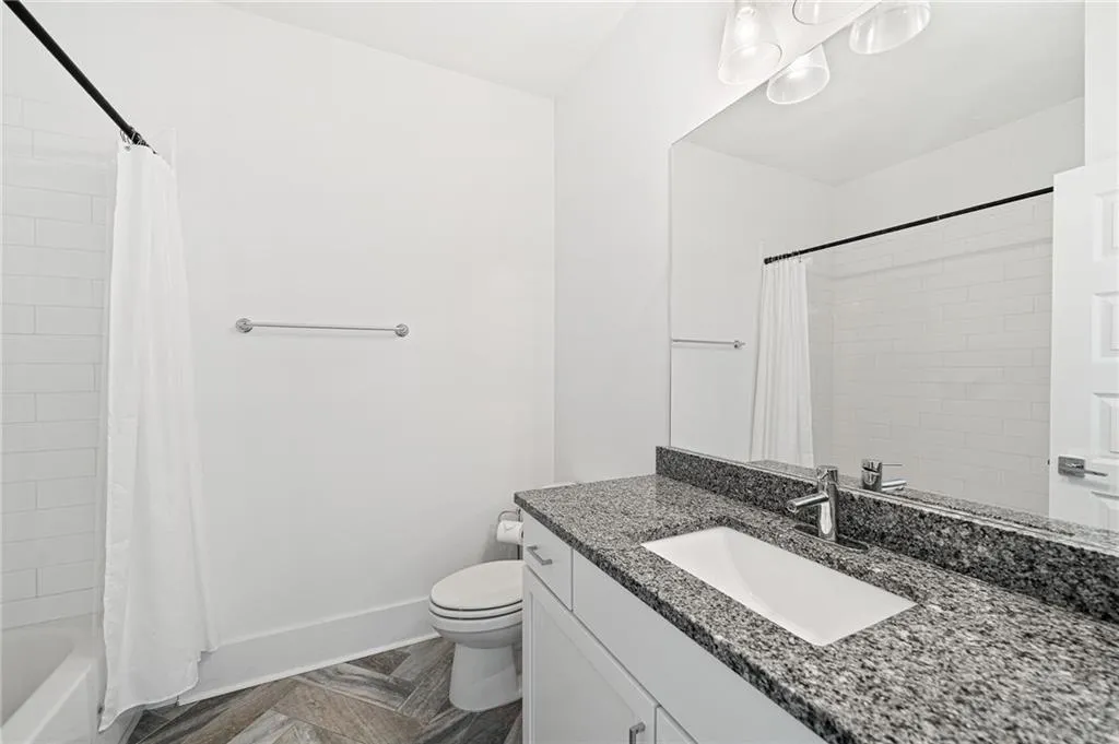 Full bathroom with vanity and shower / bath combination with curtain