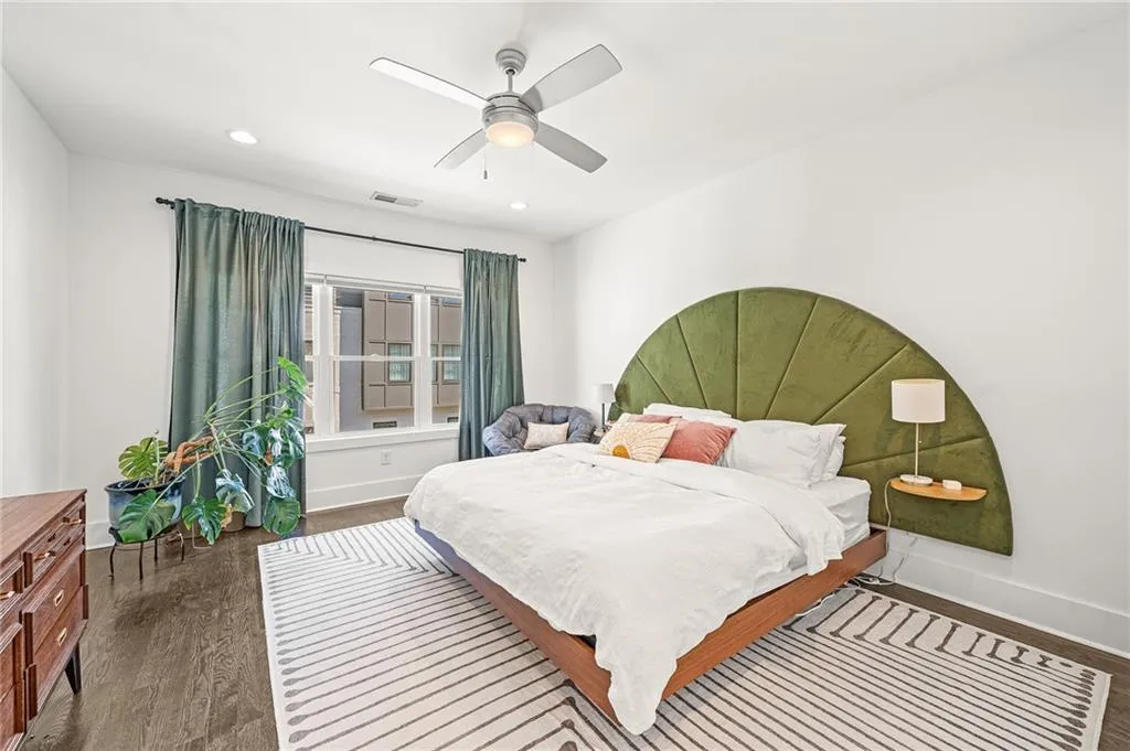 Bedroom with dark wood-style flooring, recessed lighting, and ceiling fan
