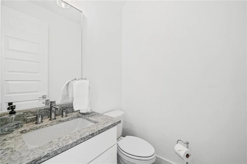 Bathroom with vanity and toilet