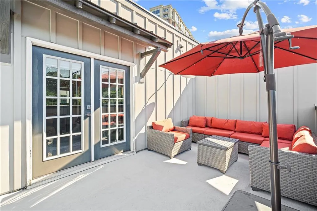 View of patio with outdoor lounge area and french doors