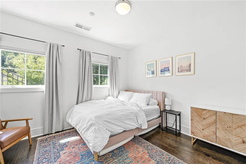 Bedroom featuring wood finished floors and baseboards
