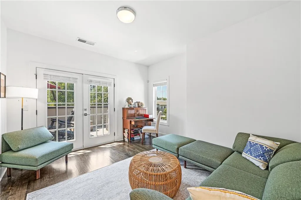 Living room featuring french doors and wood finished floors