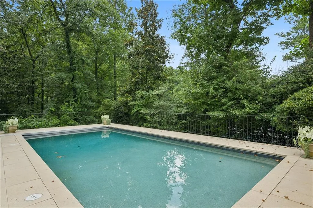 Heated pool with retractable cover