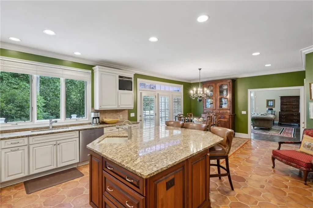 Large stained island with second sink and breakfast bar